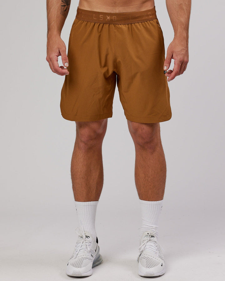 Man wearing Competition 8" Performance Short - Camel