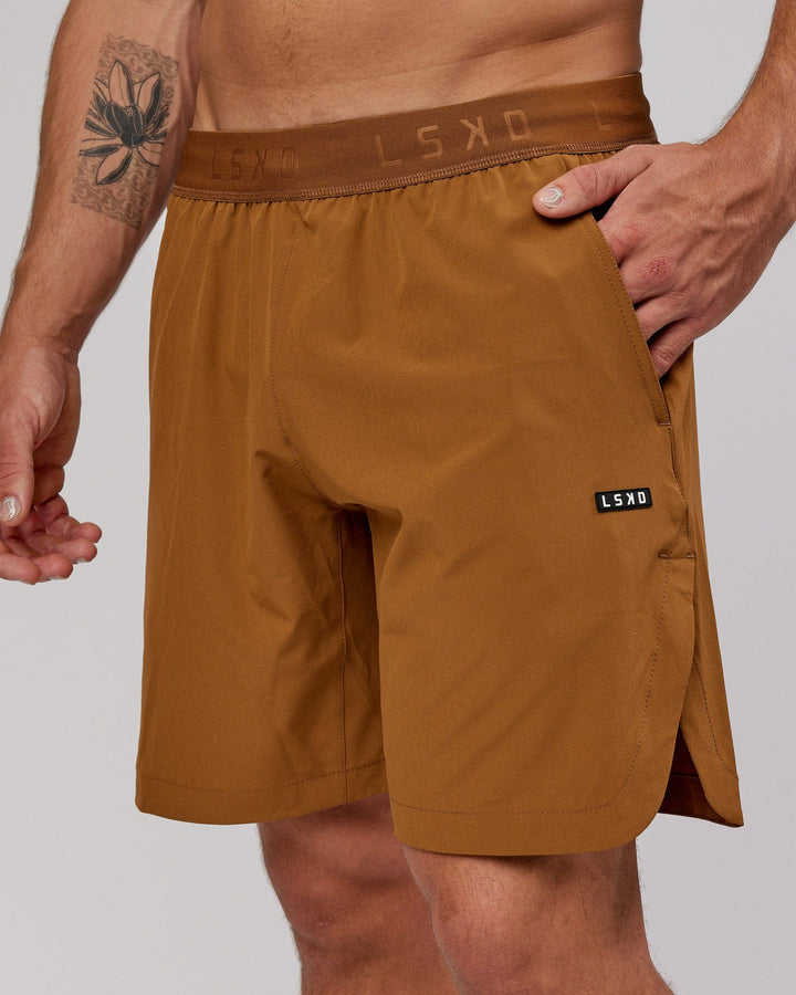 Man wearing Competition 8" Performance Short - Camel
