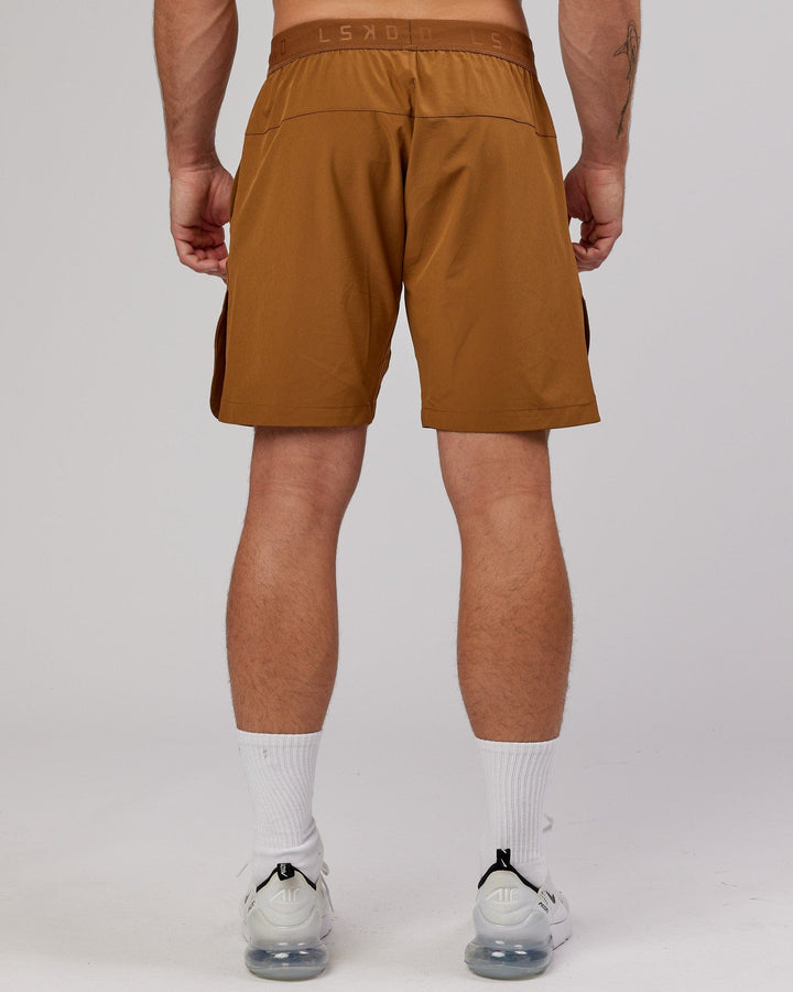 Man wearing Competition 8" Performance Short - Camel