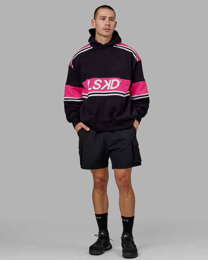 Man wearing Unisex A-Team Hoodie Oversize - Black-Pink