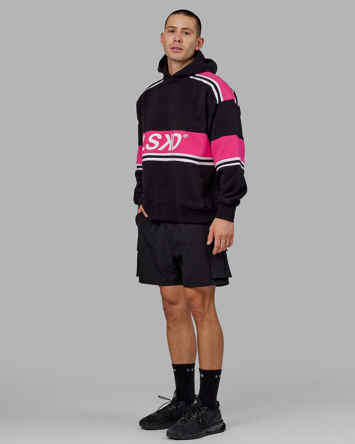 Man wearing Unisex A-Team Hoodie Oversize - Black-Pink