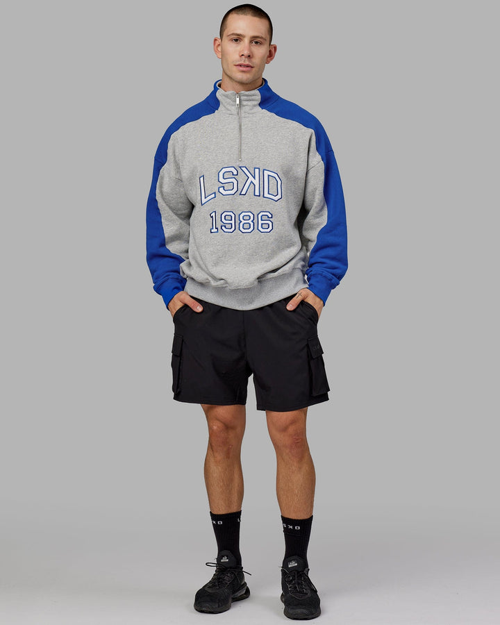 Man wearing Unisex Alumni 1/4 Zip Sweater Oversize - Grey-Blue