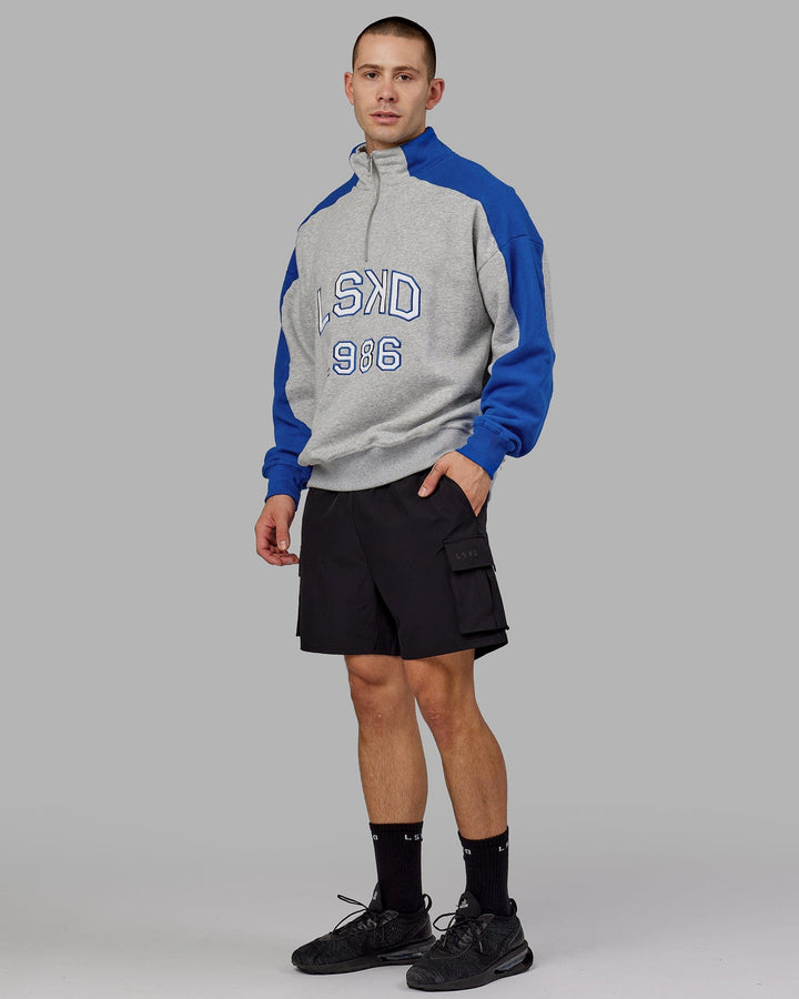 Man wearing Unisex Alumni 1/4 Zip Sweater Oversize - Grey-Blue