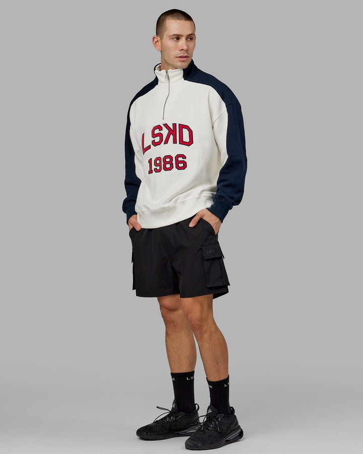 Man wearing Unisex Alumni 1/4 Zip Sweater Oversize - Navy-Red