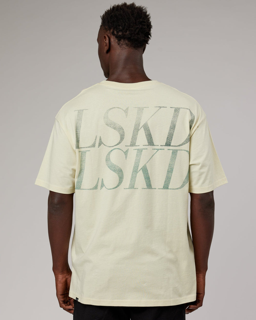 Man wearing Unisex Aurora Oversize Tee - Almond Milk
