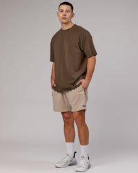 Man wearing Unisex Capsule FLXCotton Tee Oversize - Army Green