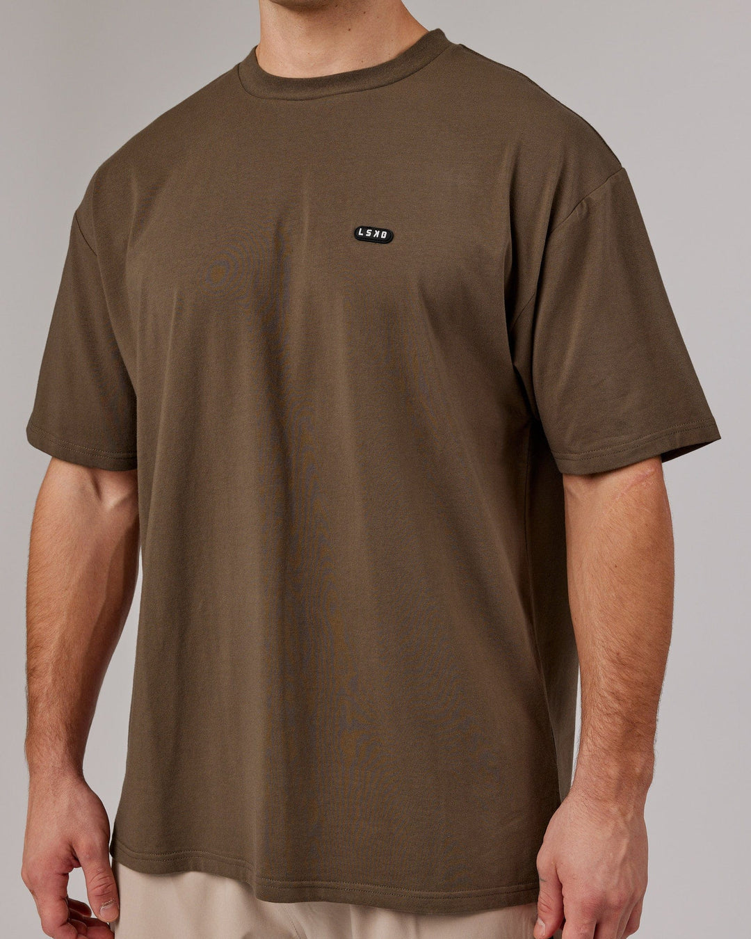 Man wearing Unisex Capsule FLXCotton Tee Oversize - Army Green