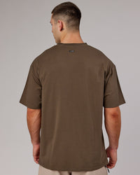 Man wearing Unisex Capsule FLXCotton Tee Oversize - Army Green