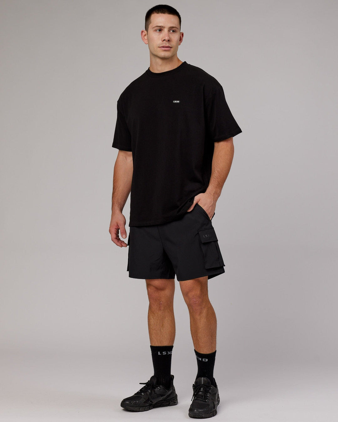Man wearing Unisex Capsule FLXCotton Tee Oversize - Black
