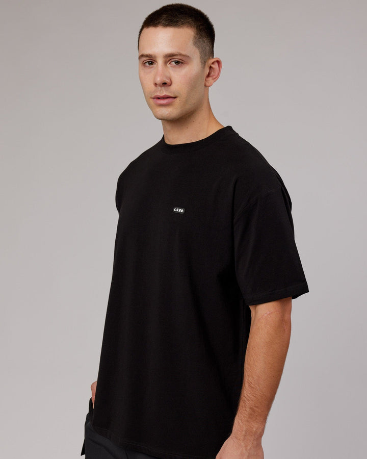 Man wearing Unisex Capsule FLXCotton Tee Oversize - Black