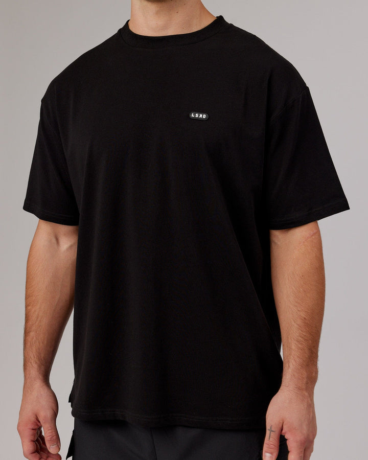 Man wearing Unisex Capsule FLXCotton Tee Oversize - Black