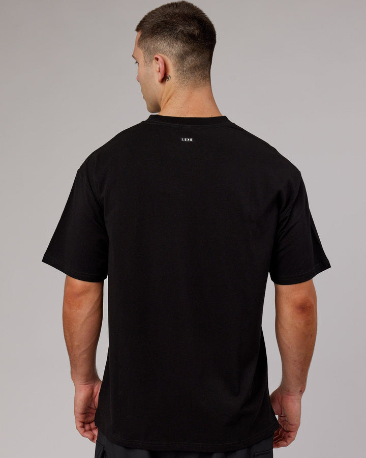 Man wearing Unisex Capsule FLXCotton Tee Oversize - Black