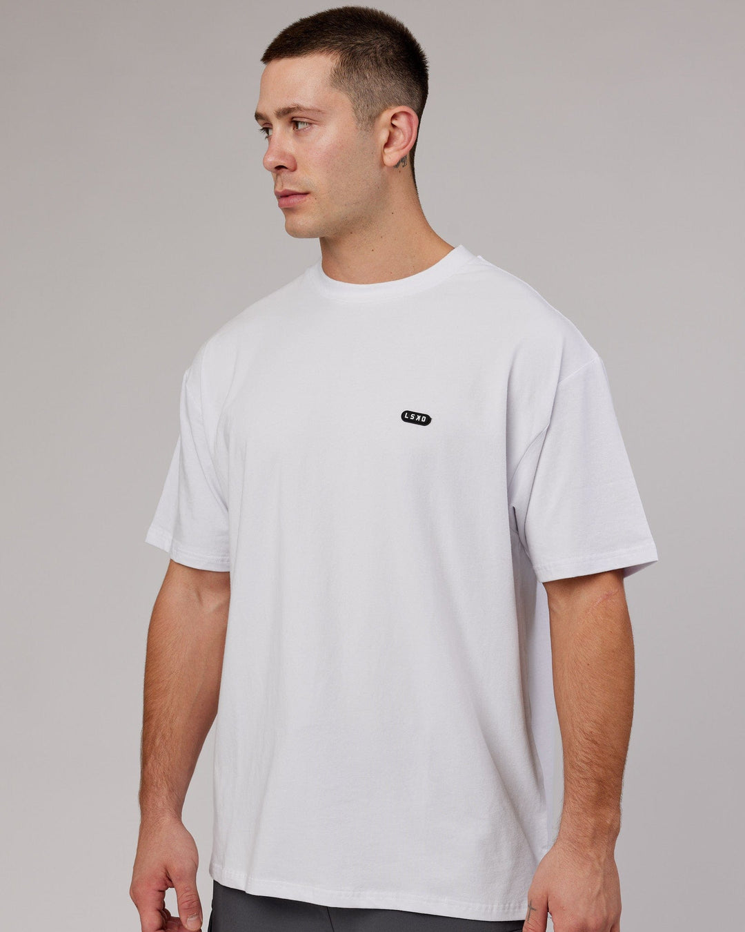 Man wearing Unisex Capsule FLXCotton Tee Oversize - White