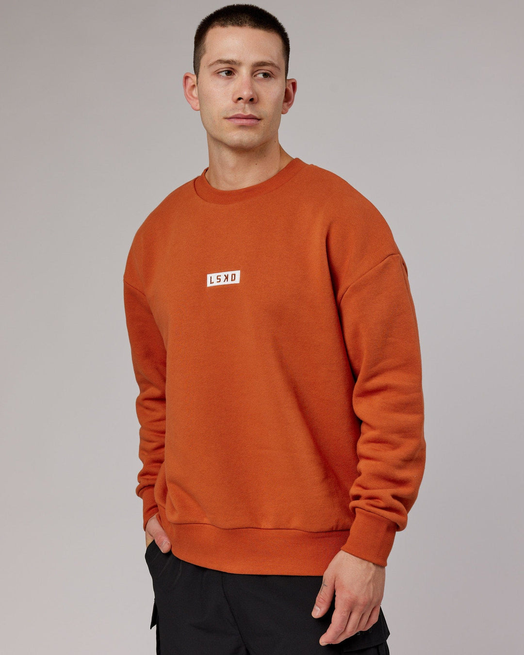 Man wearing Unisex Cornerstone Sweater Oversize - Auburn