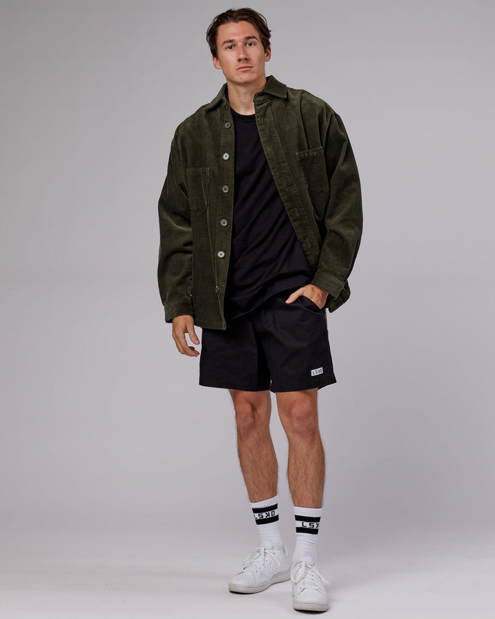 man wearing Unisex Iconic Cord Shacket - Forest Night