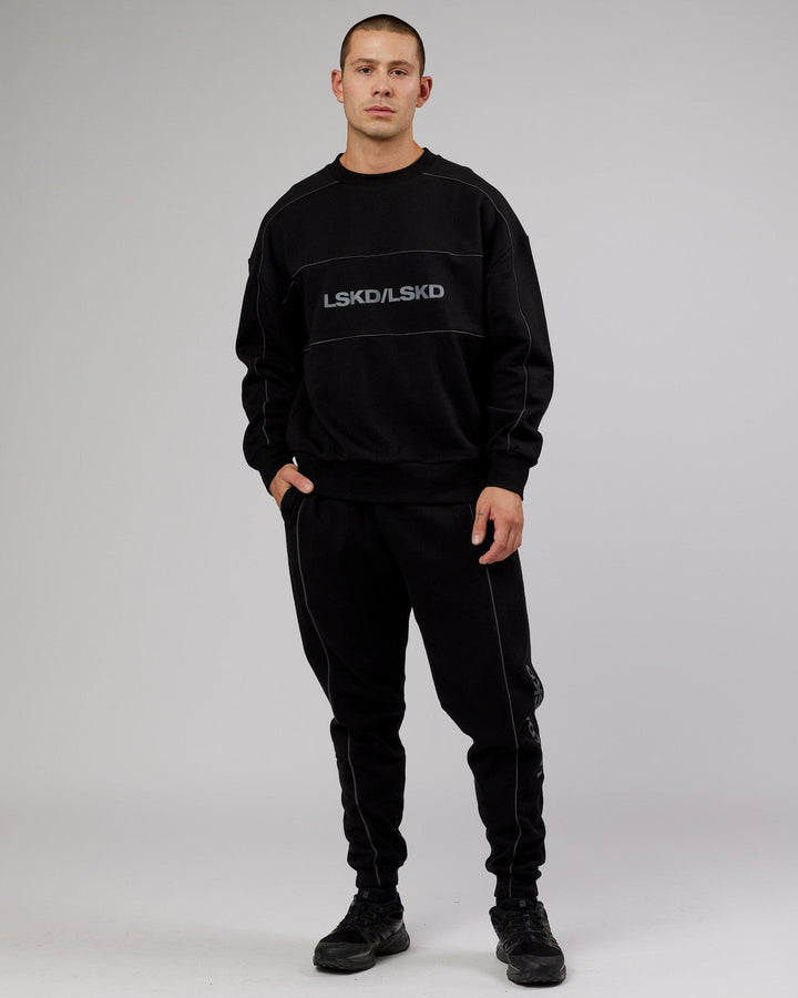 Man wearing Unisex Impact Sweater Oversize - Black-Grey