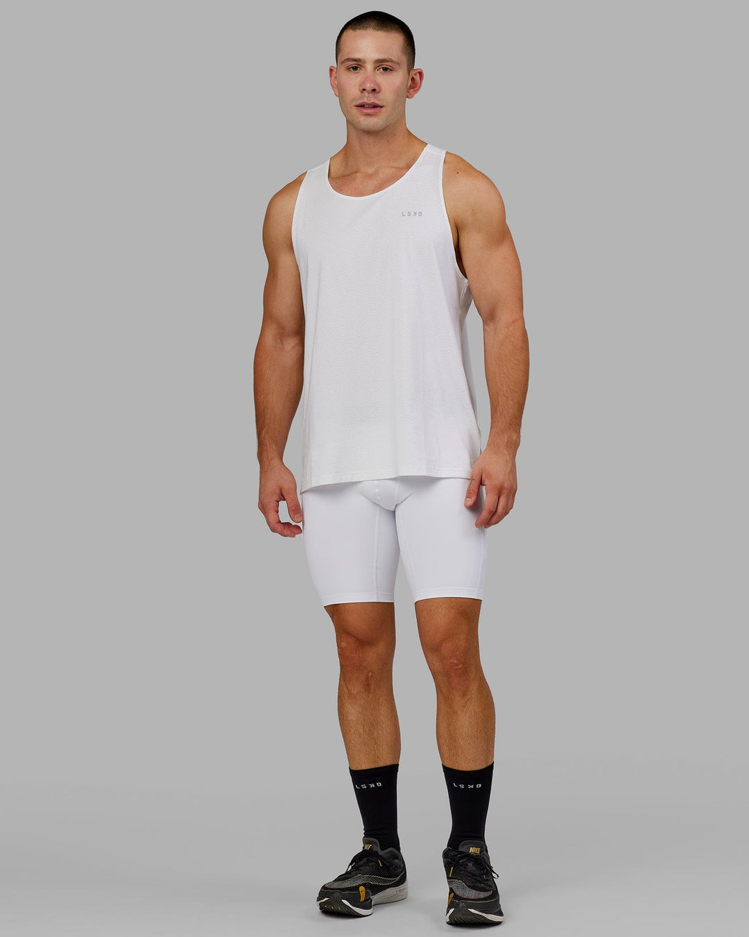 Man wearing Men's Perform Short Tight - White