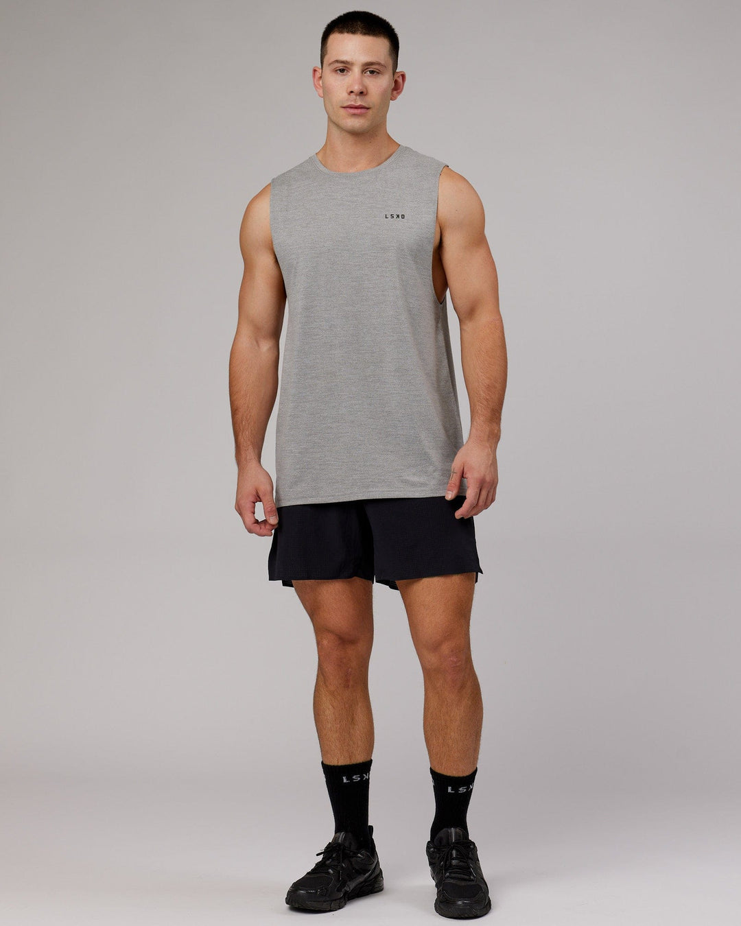 Man wearing Perform VapourFLX Muscle Tank - Light Grey Marl