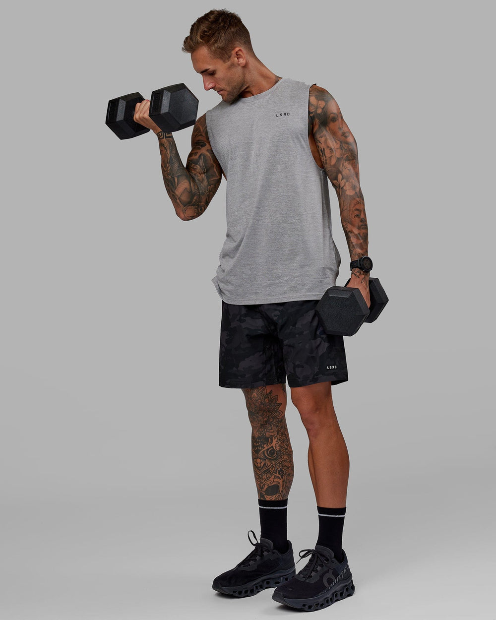 Man wearing Perform VapourFLX Muscle Tank - Light Grey Marl