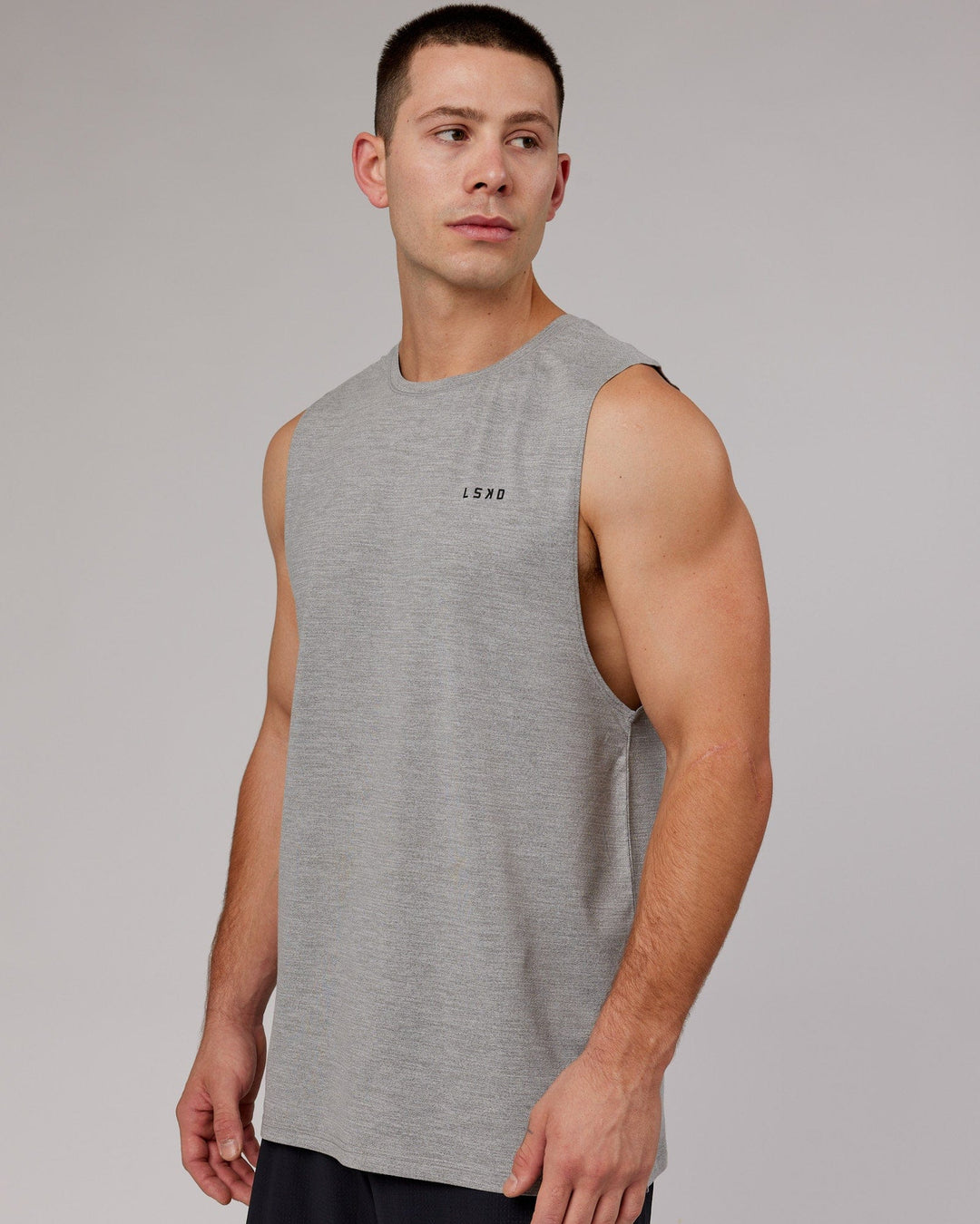 Man wearing Perform VapourFLX Muscle Tank - Light Grey Marl