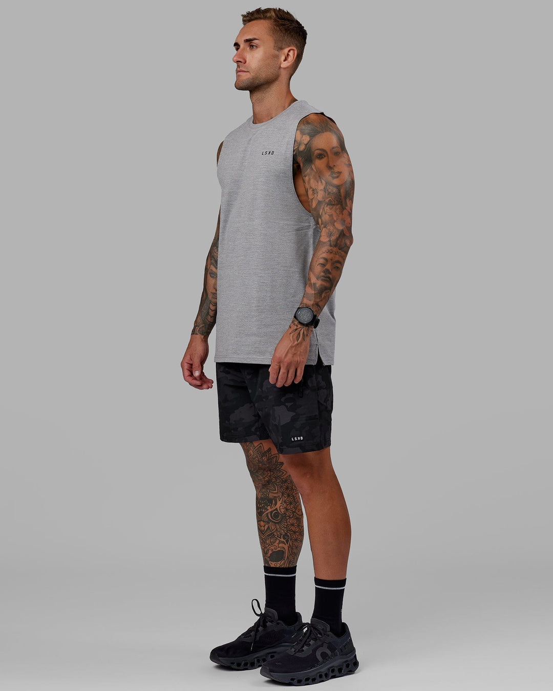 Man wearing Perform VapourFLX Muscle Tank - Light Grey Marl