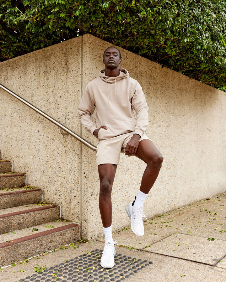 Man wearing Unisex Perimeter FLXFleece Hoodie - Taupe