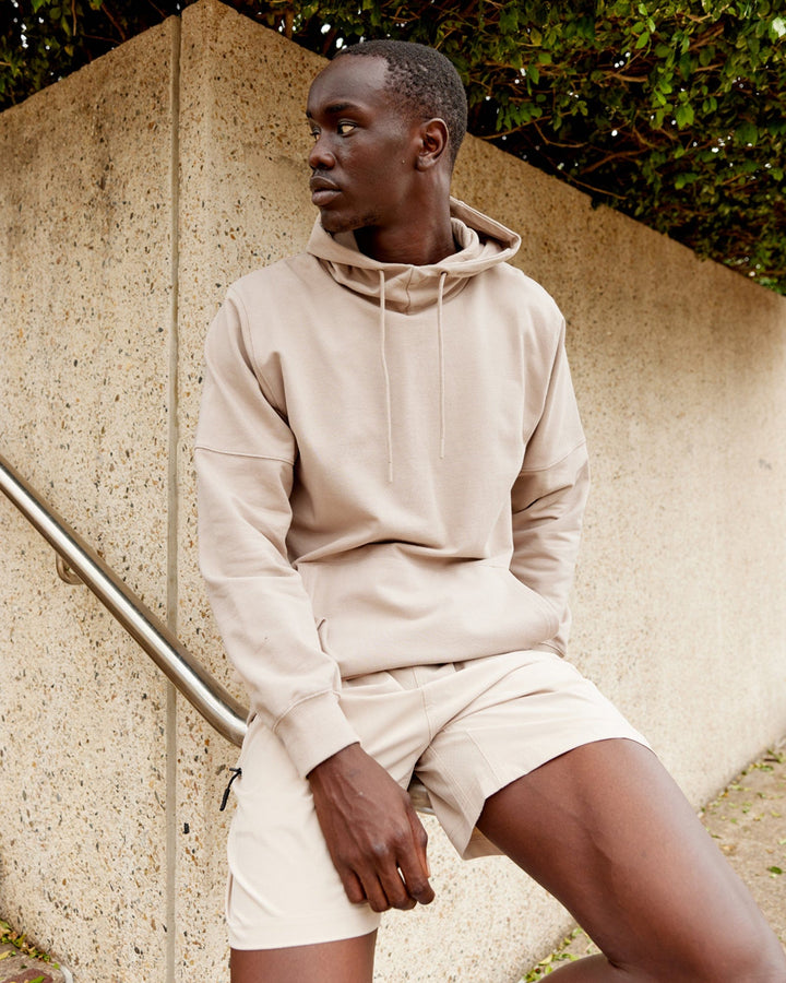 Man wearing Unisex Perimeter FLXFleece Hoodie - Taupe