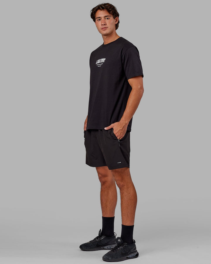 Man wearing Unisex Standard Heavyweight Tee Oversize - Black-White