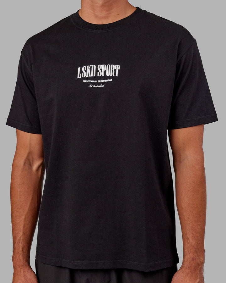 Man wearing Unisex Standard Heavyweight Tee Oversize - Black-White