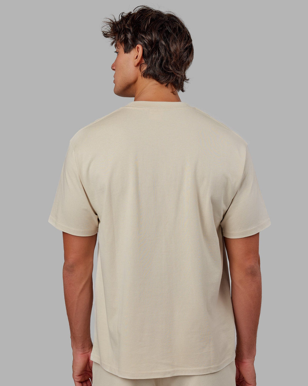 Man wearing Unisex Standard Heavyweight Tee Oversize - Bone