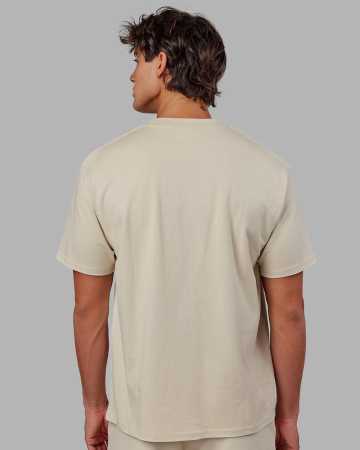 Man wearing Unisex Standard Heavyweight Tee Oversize - Bone