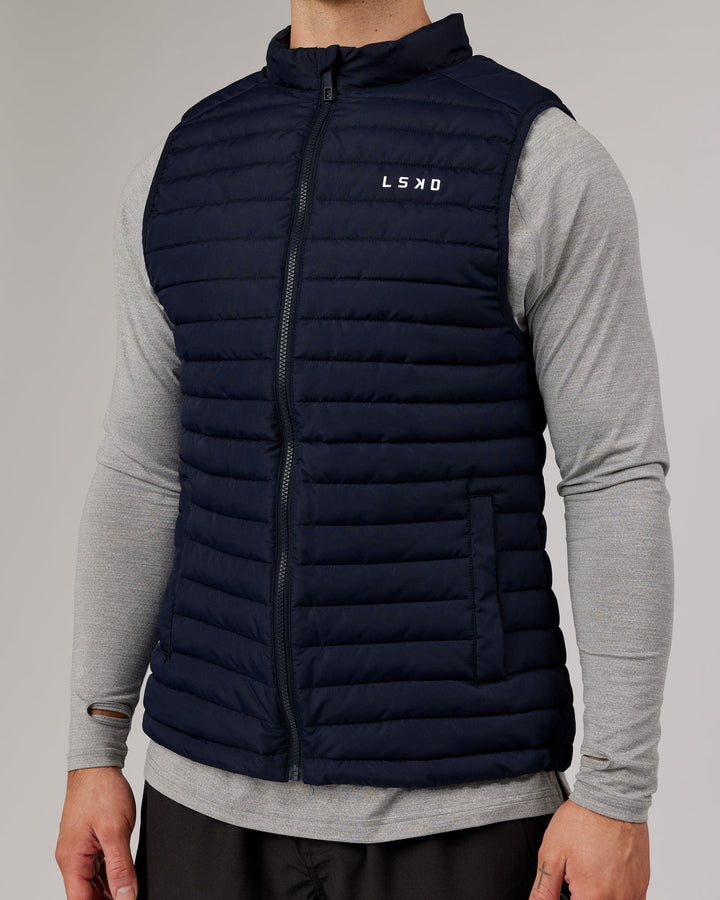 Man wearing Uplift Puffer Vest - Navy