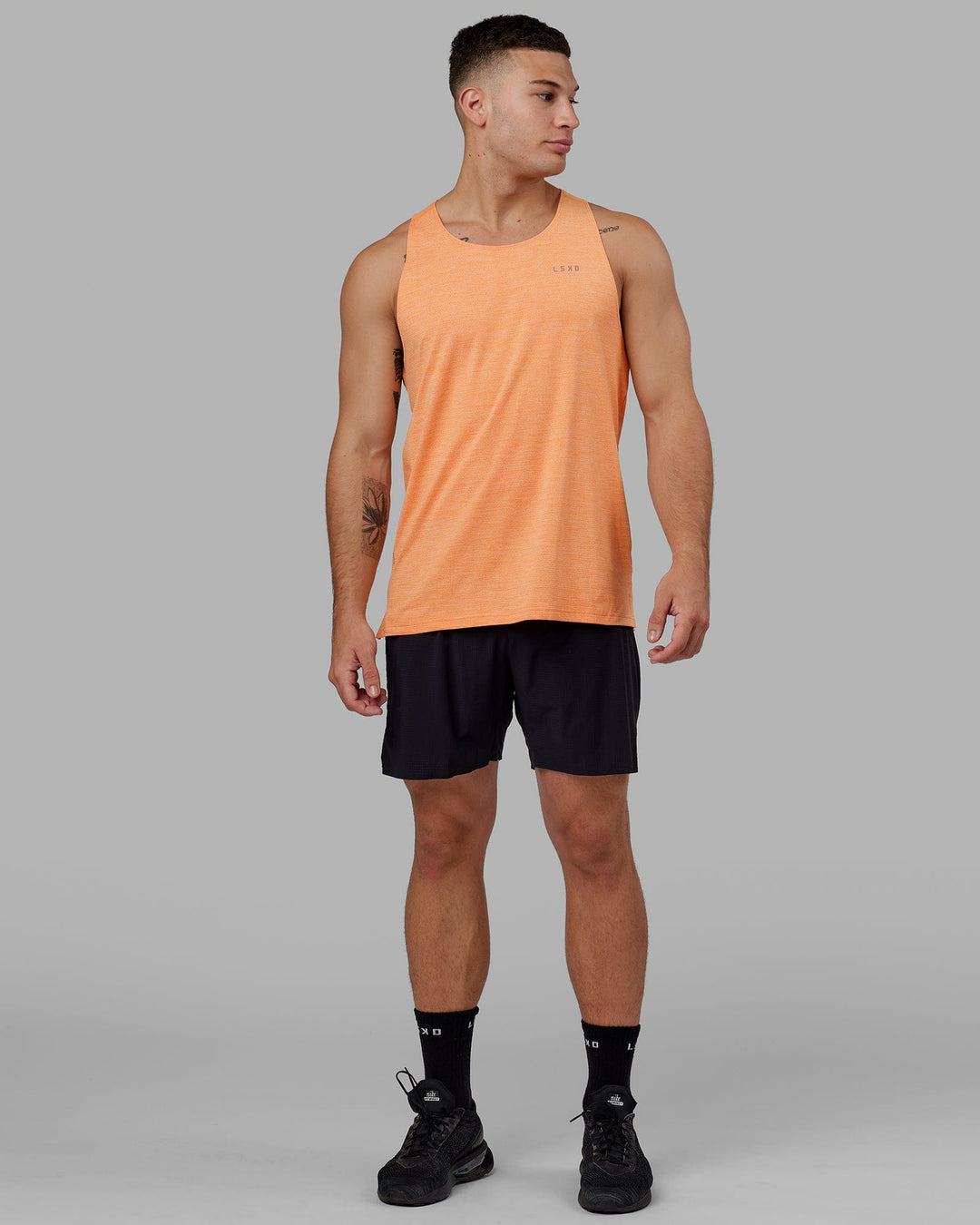 Man wearing Perform VapourFLX Tank - Tangerine Marl