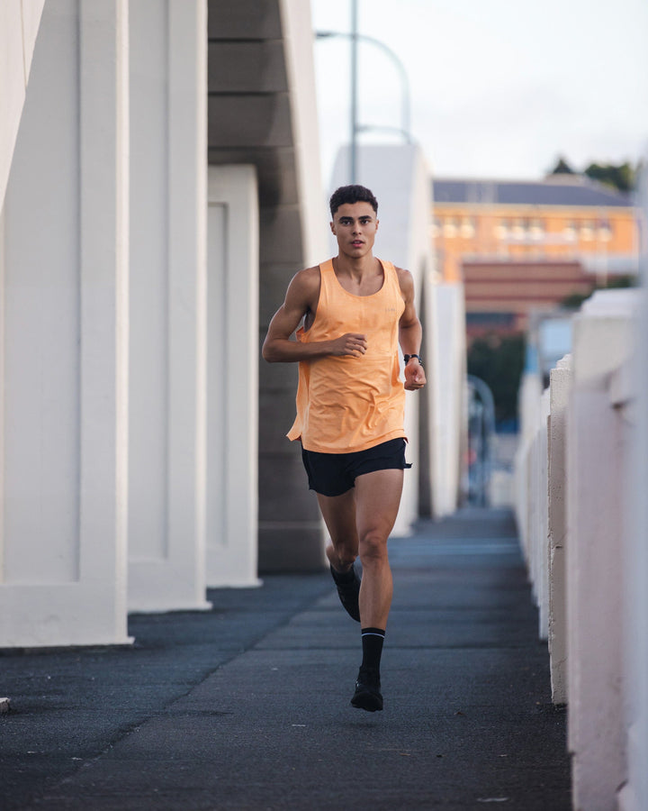 Man wearing Perform VapourFLX Tank - Tangerine Marl