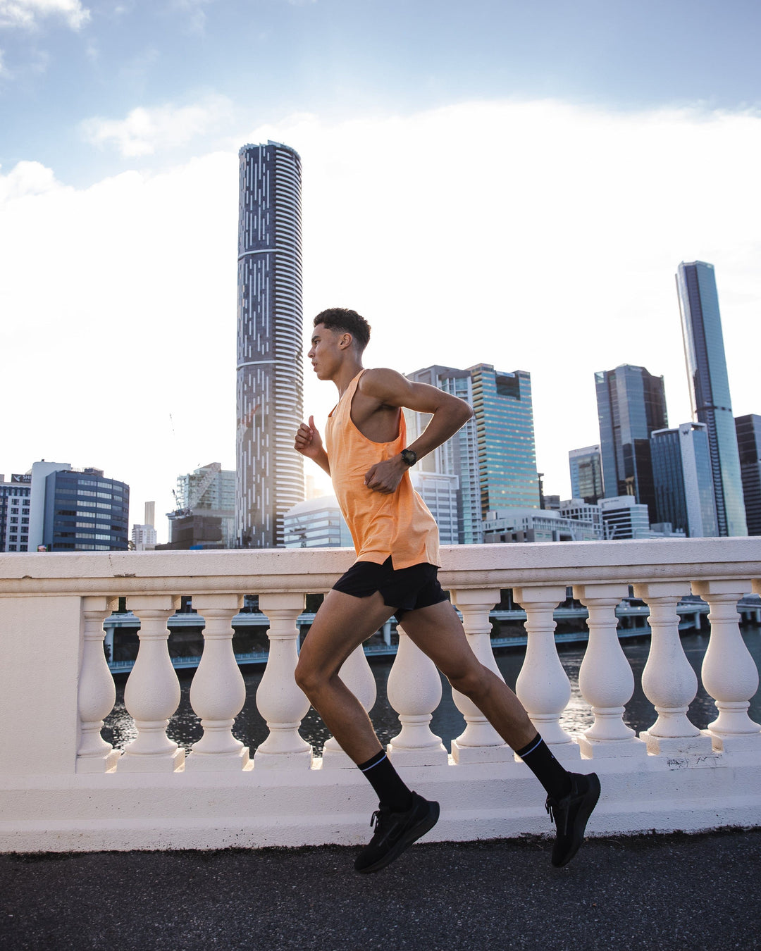 Man wearing Perform VapourFLX Tank - Tangerine Marl