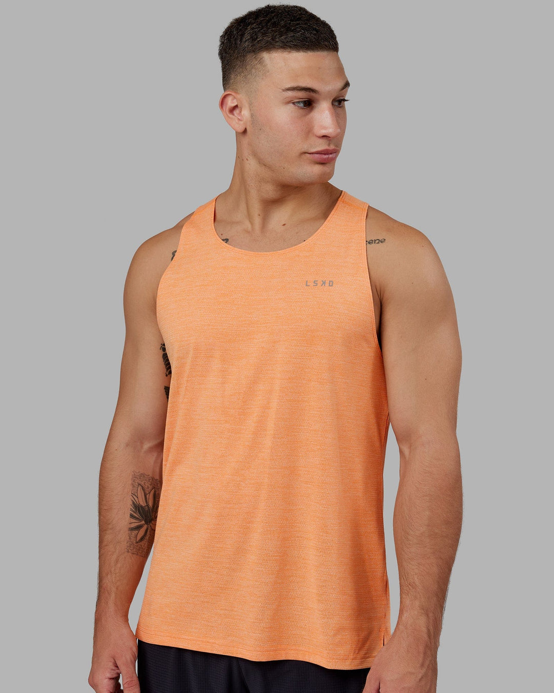 Man wearing Perform VapourFLX Tank - Tangerine Marl