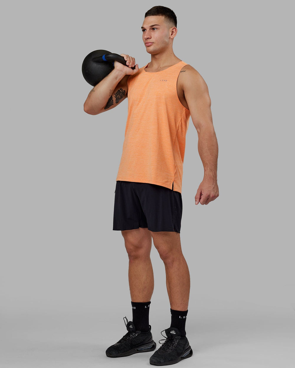Man wearing Perform VapourFLX Tank - Tangerine Marl