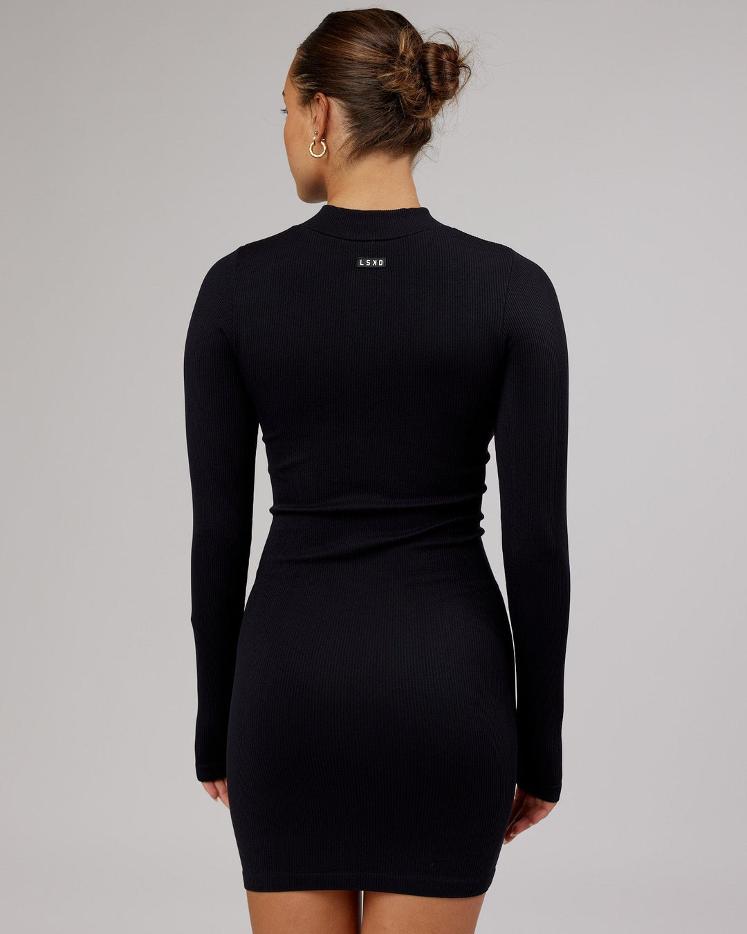 Woman wearing Minimal Ribbed Seamless LS Dress - Black
