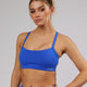 Woman wearing Momentum Sports Bra - Sapphire