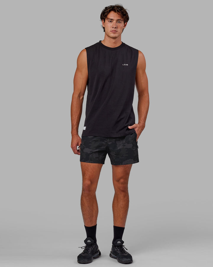 Man wearing Rep 5" Performance Short - Black Camo