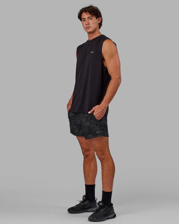 Man wearing Rep 5" Performance Short - Black Camo