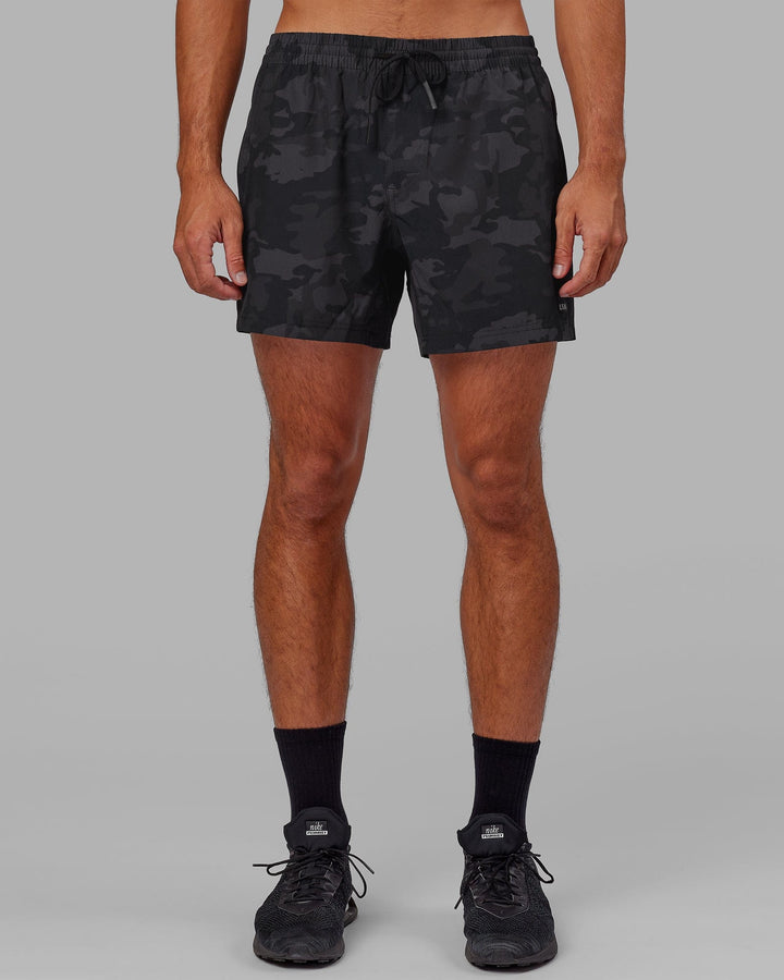 Man wearing Rep 5" Performance Short - Black Camo