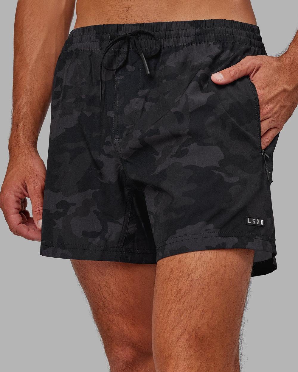 Man wearing Rep 5" Performance Short - Black Camo
