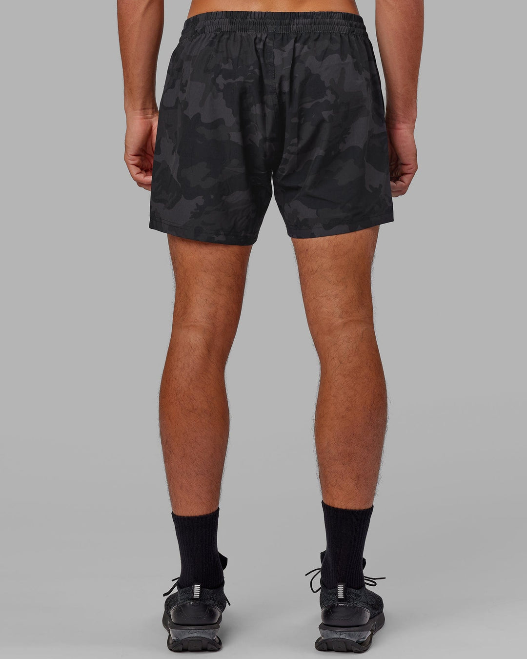 Man wearing Rep 5" Performance Short - Black Camo