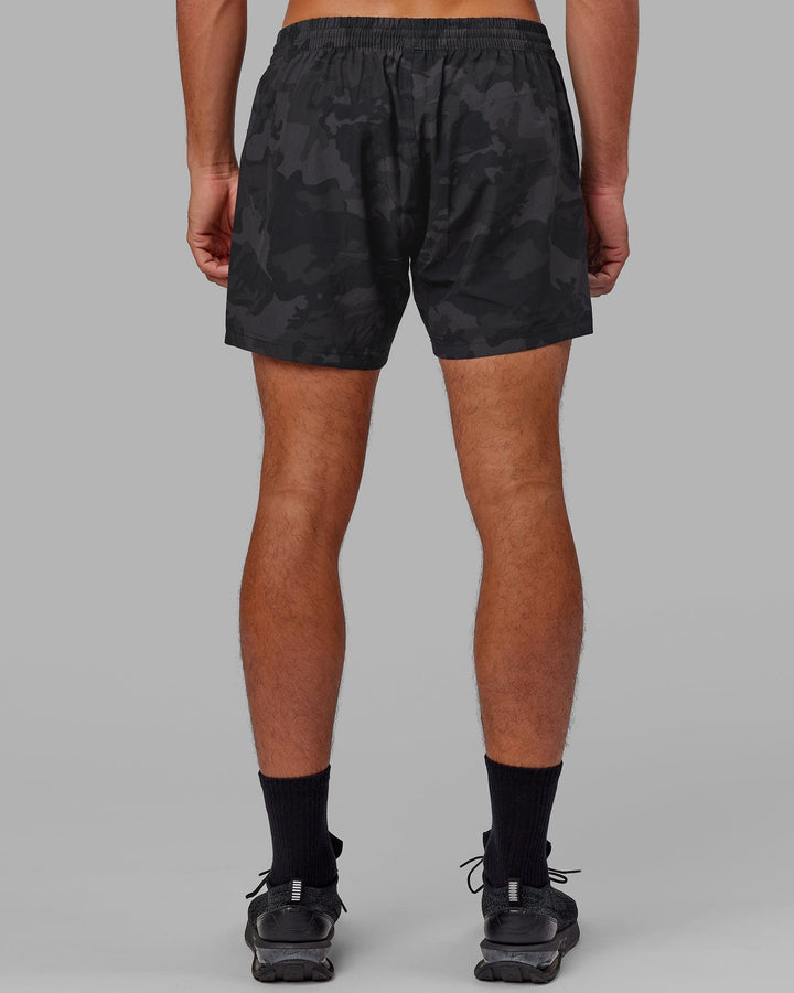 Man wearing Rep 5" Performance Short - Black Camo