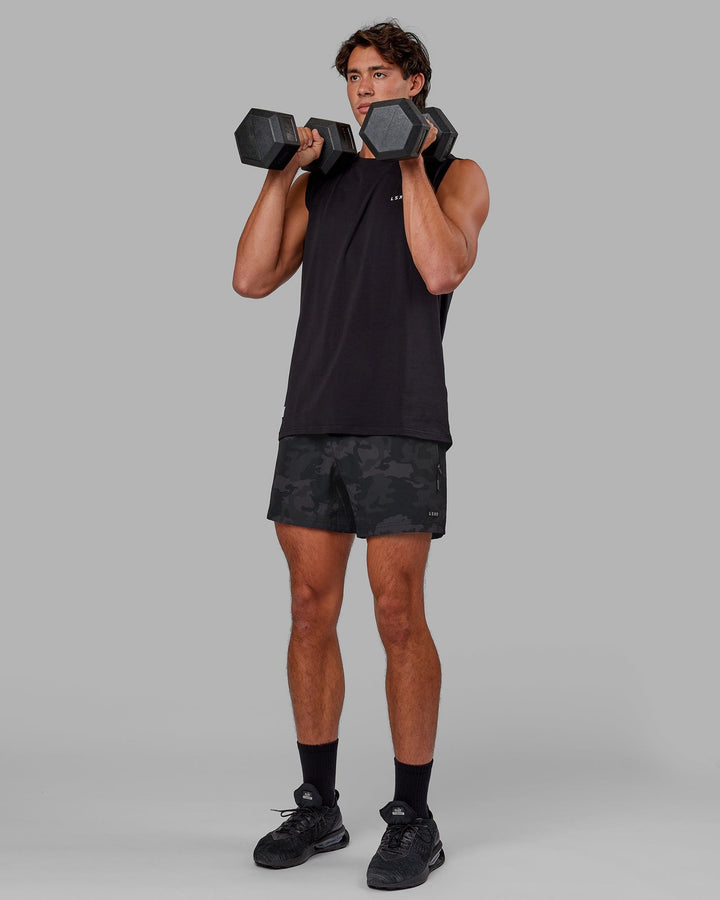 Man wearing Rep 5" Performance Short - Black Camo