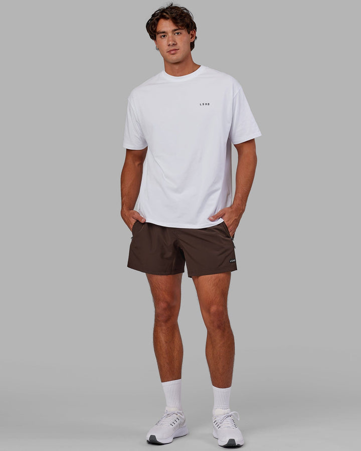 Man wearing Rep 5'' Performance Short - Dark Chocolate