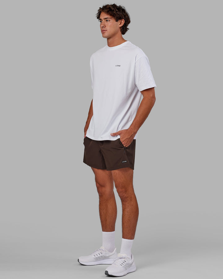 Man wearing Rep 5'' Performance Short - Dark Chocolate