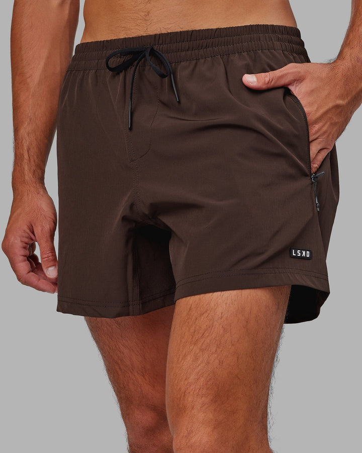 Man wearing Rep 5'' Performance Short - Dark Chocolate