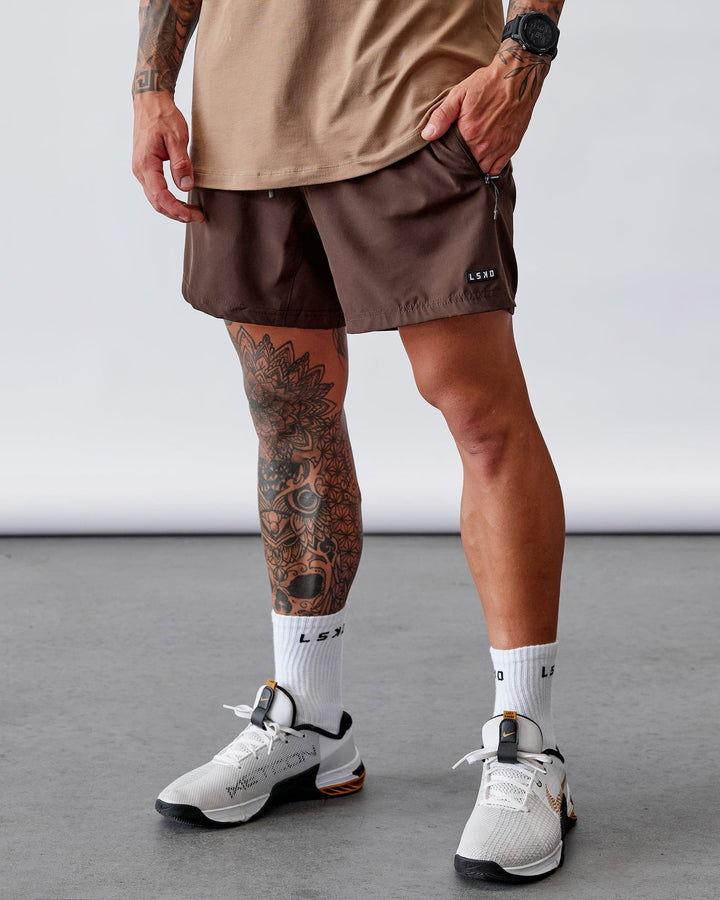 Man wearing Rep 5'' Performance Short - Dark Chocolate